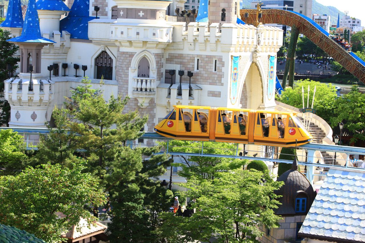 Lotte World sky monorail gliding past the Magic Island castle, Seoul