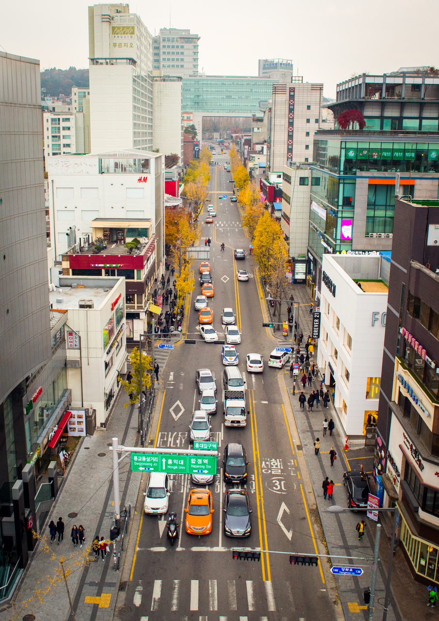 Looking down the Hongdae walking street with brand stores