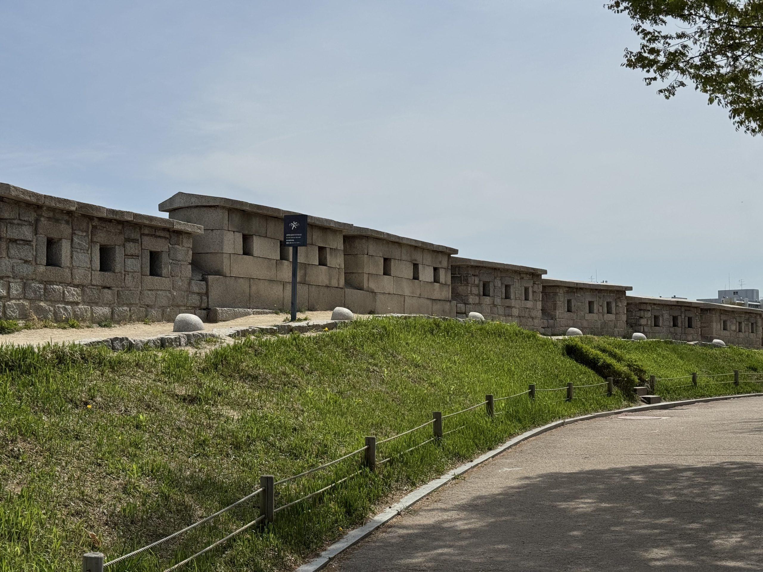 The restored Hanyangdoseong fortress wall with battlements along the Naksan ridge