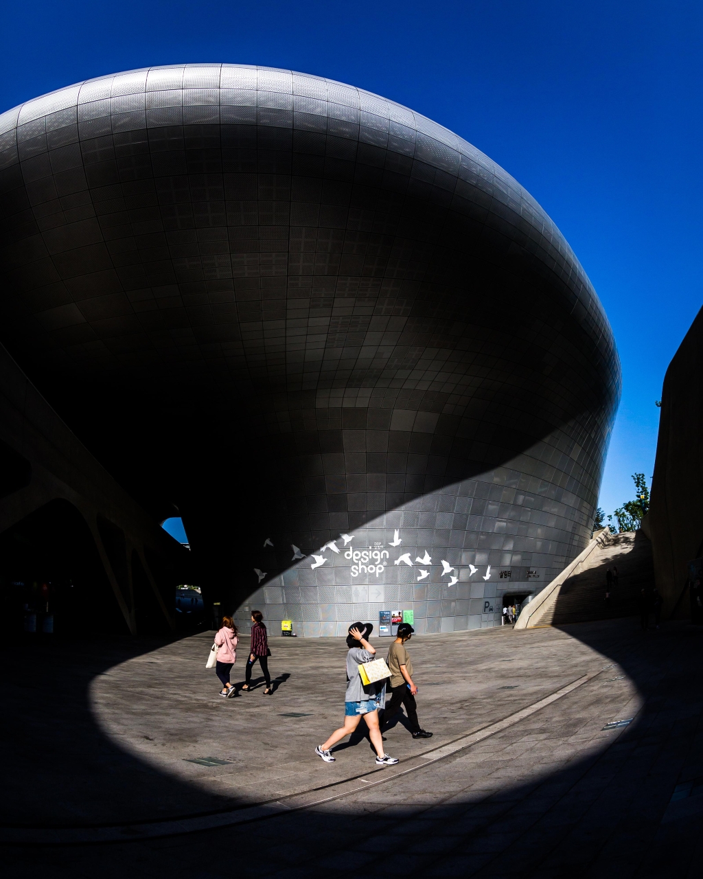 Dongdaemun Design Plaza Design Shop entrance under the silver curves by day
