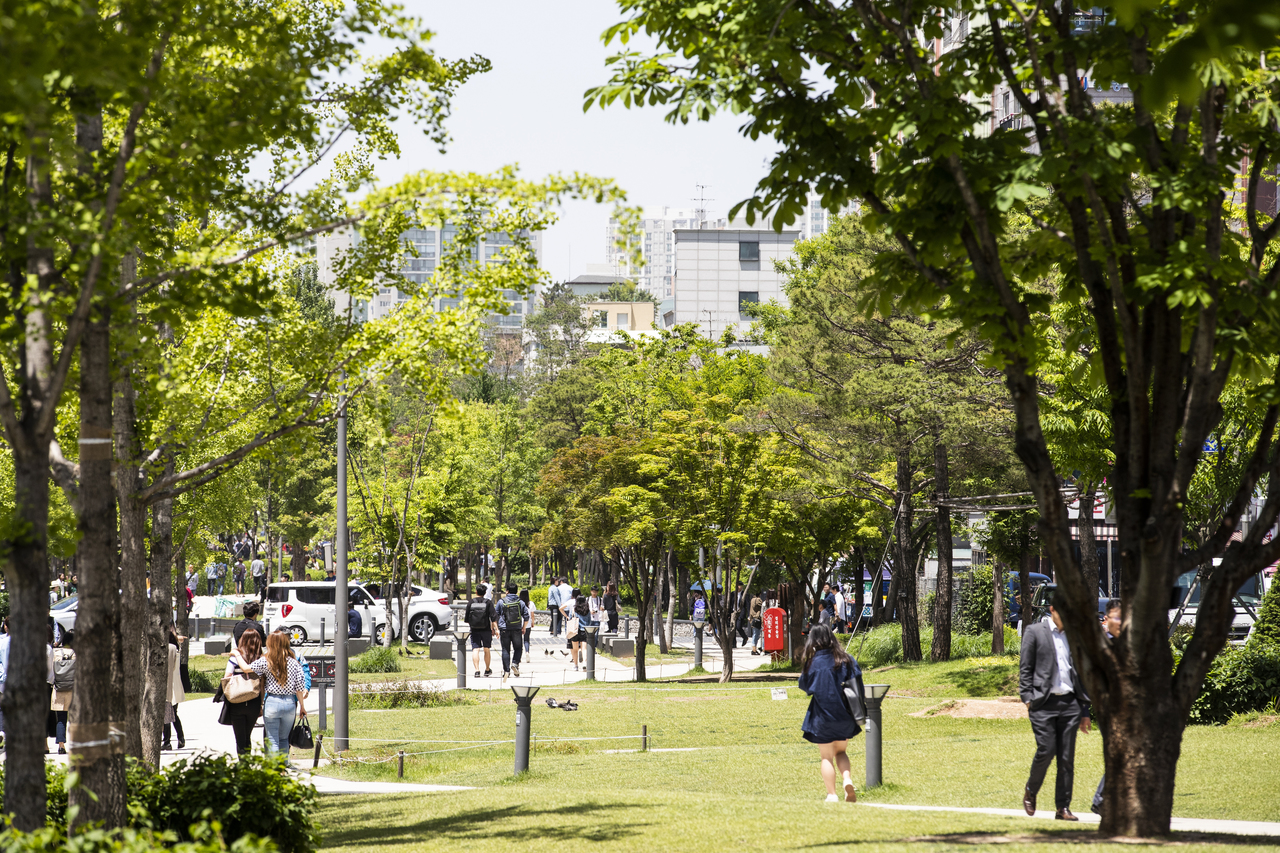 Tree-lined path and lawn at Gyeongui Line Forest Park