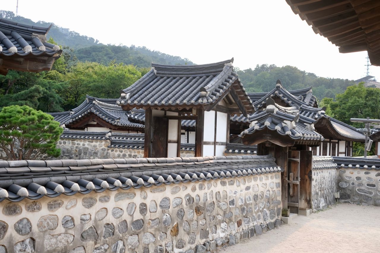 Stone walls and tiled gateways at Namsangol Hanok Village