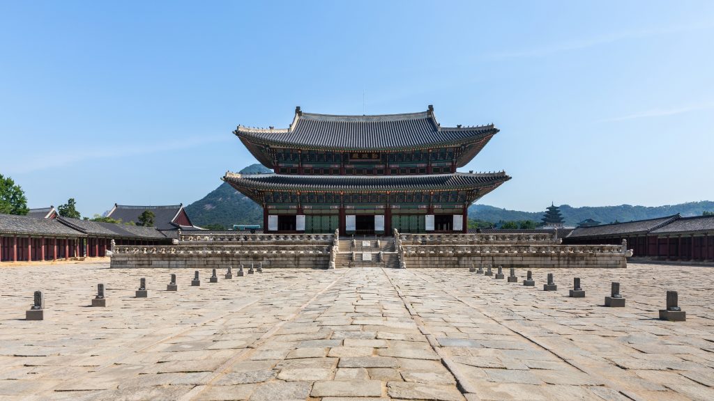 Geunjeongjeon, the throne hall of Gyeongbokgung Palace, under a blue sky in Seoul