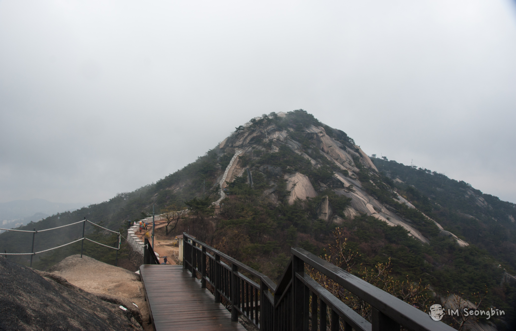 Granite summit of Inwangsan with a wooden boardwalk and railings