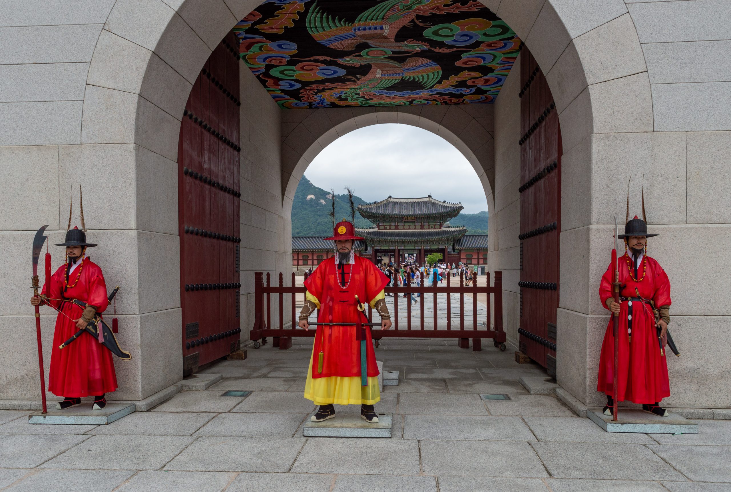 Royal guards in red robes at the Gwanghwamun gate of Gyeongbokgung Palace, Seoul