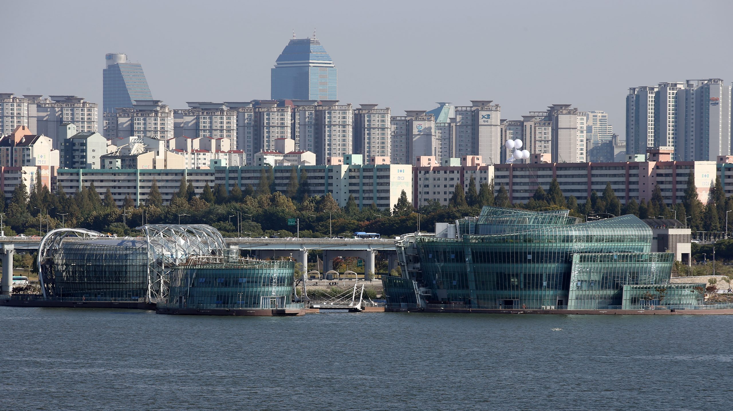 Some Sevit floating islands on the Han River near Banpo Hangang Park with Seoul skyline