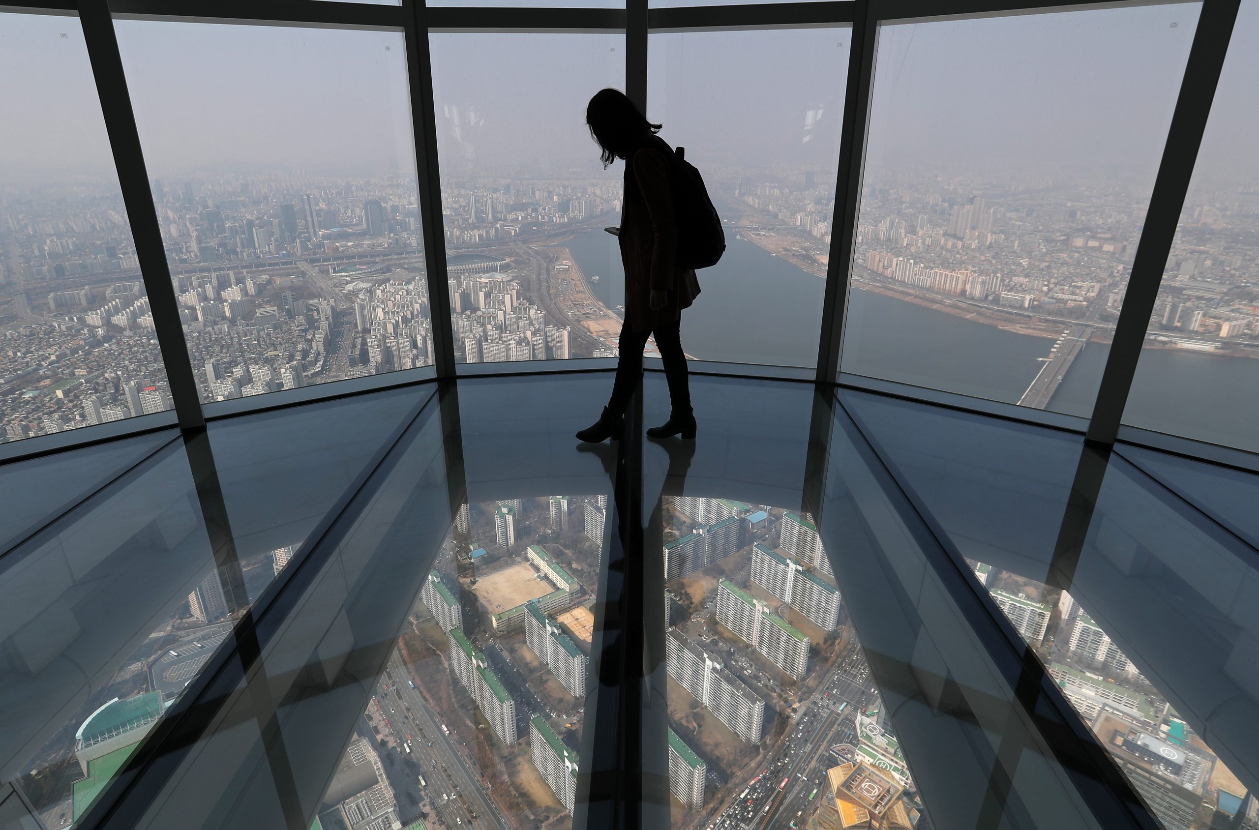 Person on the Seoul Sky glass floor at Lotte World Tower