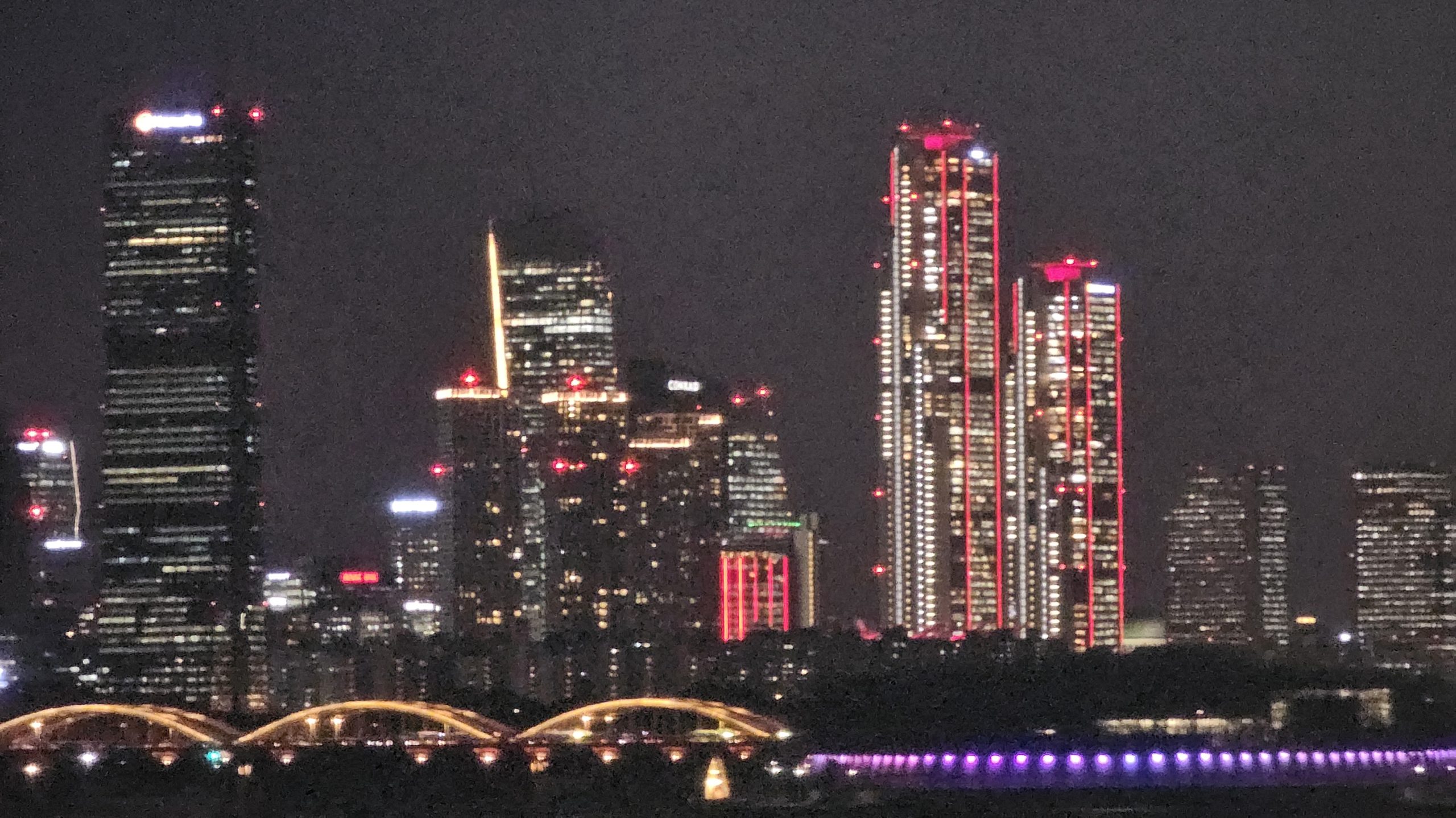 Yeouido at night with the red-lit Parc.1 towers of The Hyundai Seoul