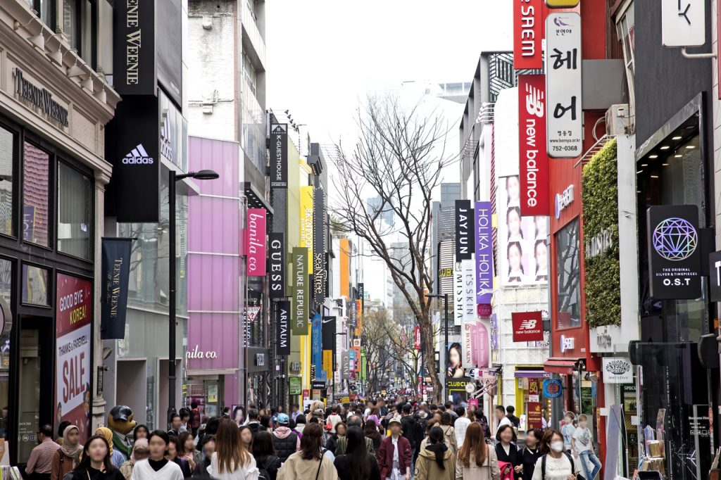 Crowds packing the brand-lined Myeongdong shopping street, Seoul