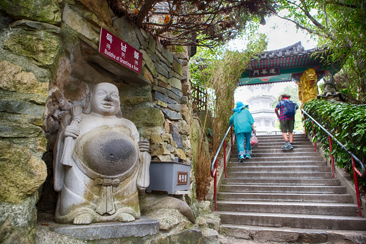 The Deuknam-bul Buddha of Granting a Son beside stone steps up to the Yongmun gate