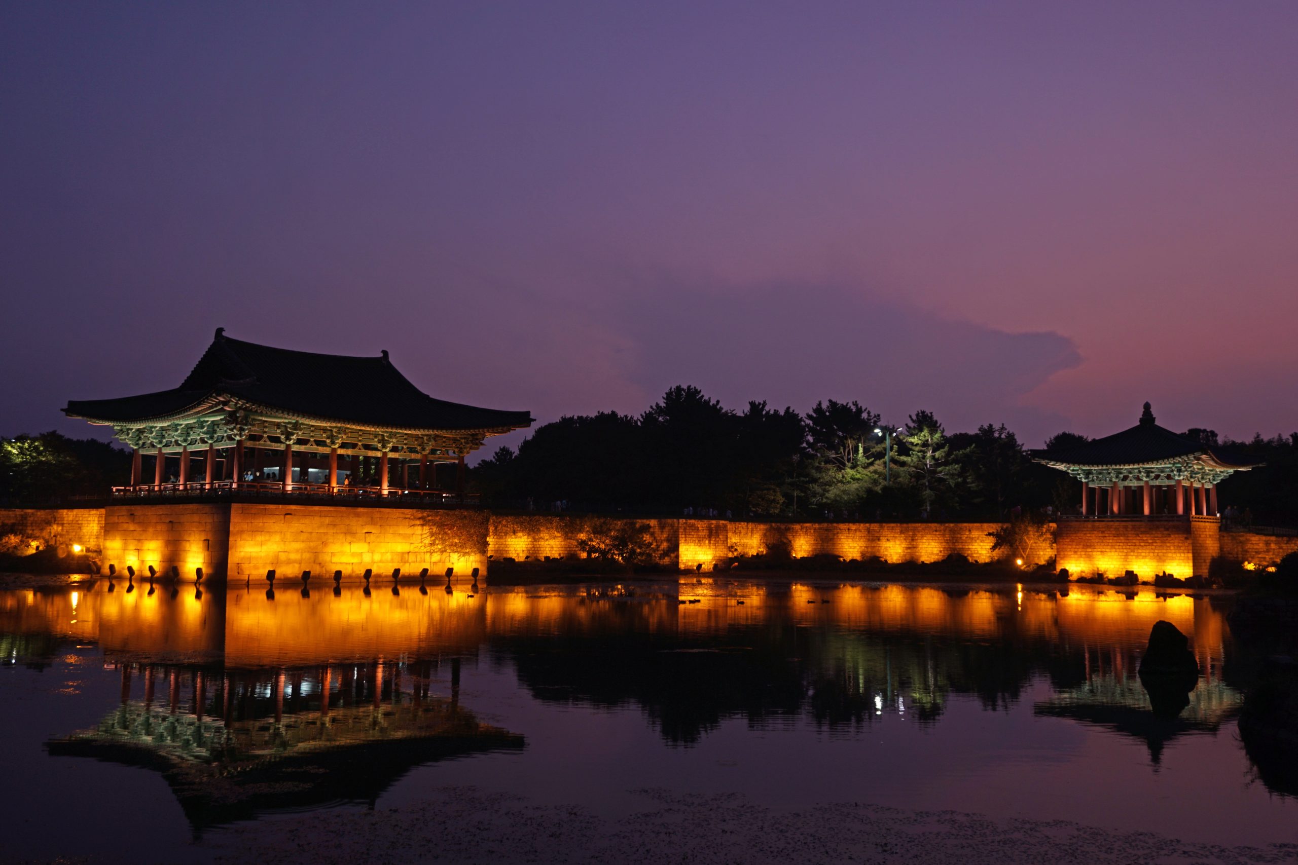 Wolji Pond pavilions reflected in the water at twilight in Gyeongju