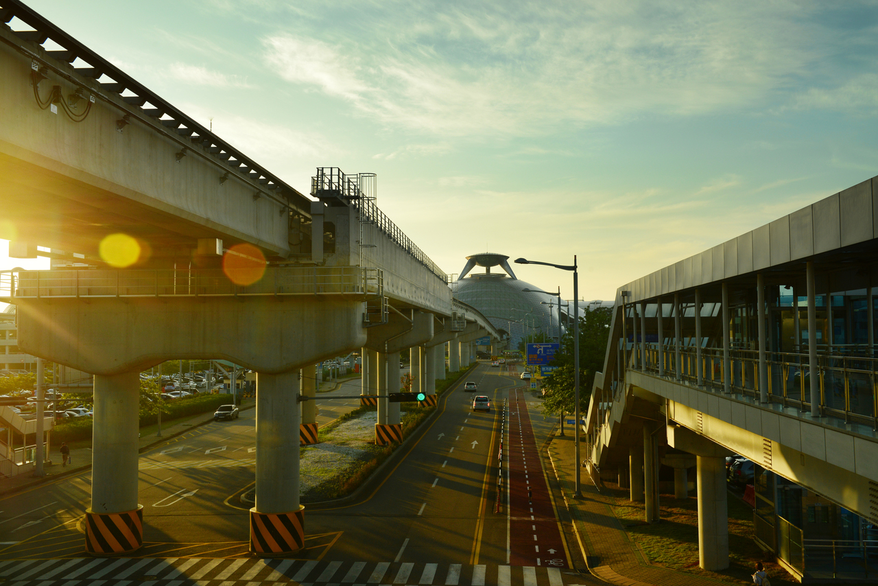 Elevated railway guideway and roadway leading to Incheon International Airport terminal