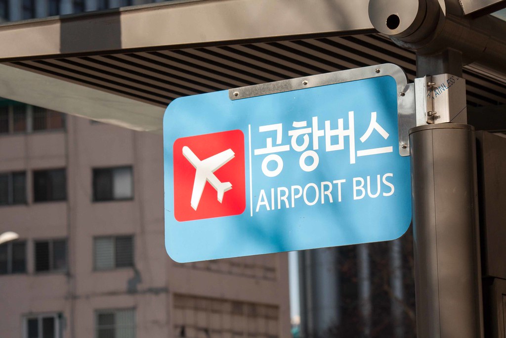 Bilingual Korean and English airport bus stop sign in Seoul