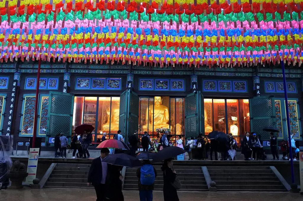 Jogyesa Temple main hall under rows of colorful lotus lanterns in Seoul
